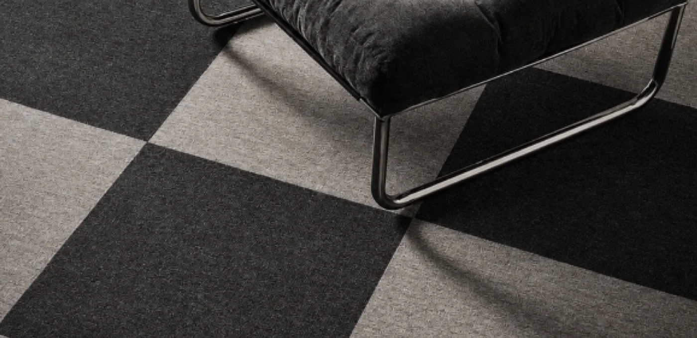 Checkerboard carpet tiles in recycled leather and nylon
